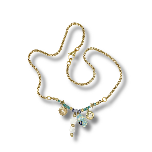 Gold necklace with gemstones on a white background