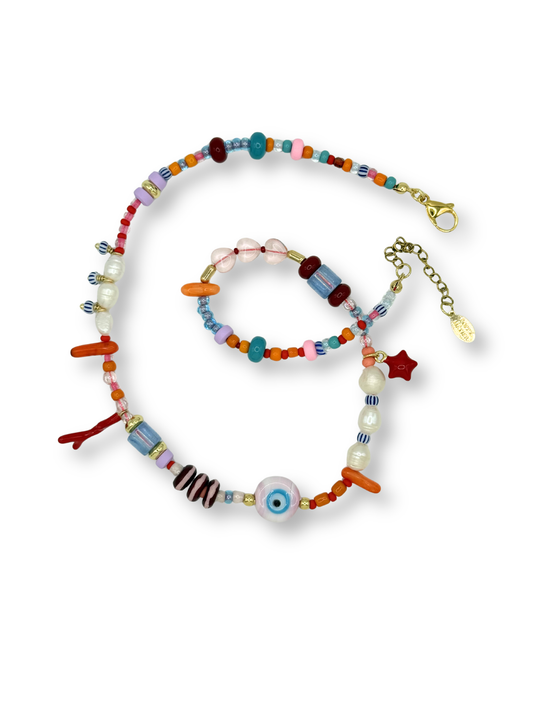 Colorful beaded necklace and bracelet set on a white background