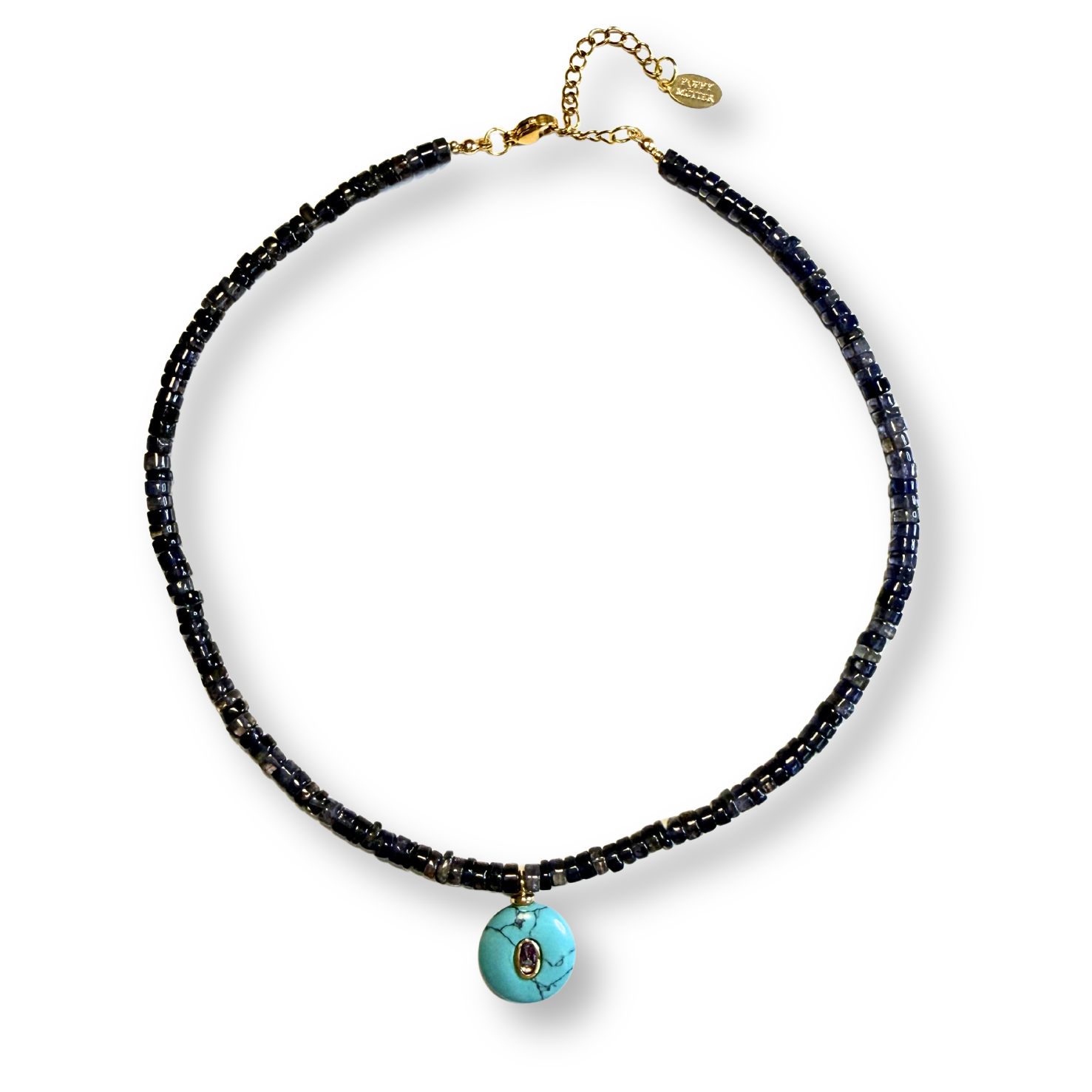 Necklace with iolite beads and a turquoise pendant on a white background