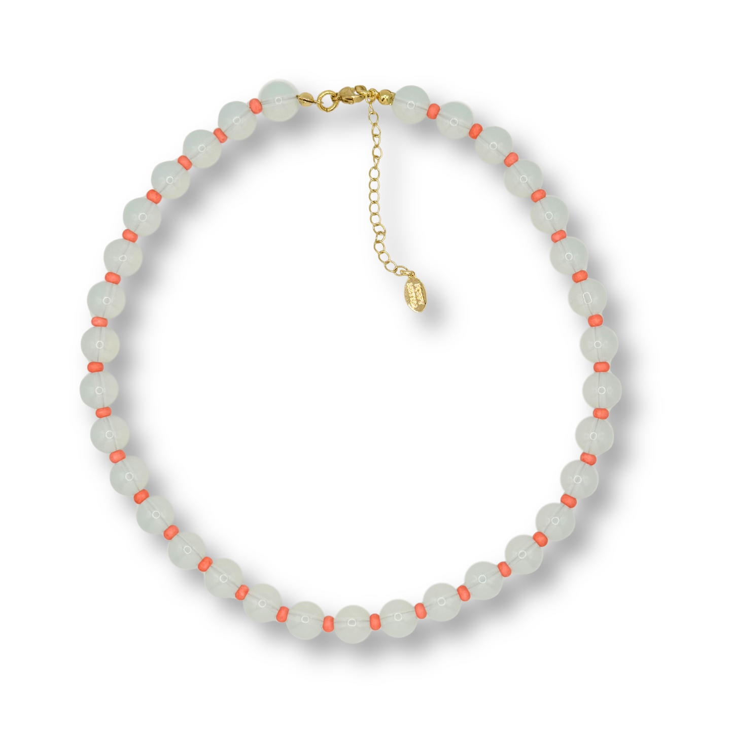 A beaded necklace featuring translucent pale greenish-white round beads with small coral-orange accents, accented by a gold-tone clasp and extender chain.