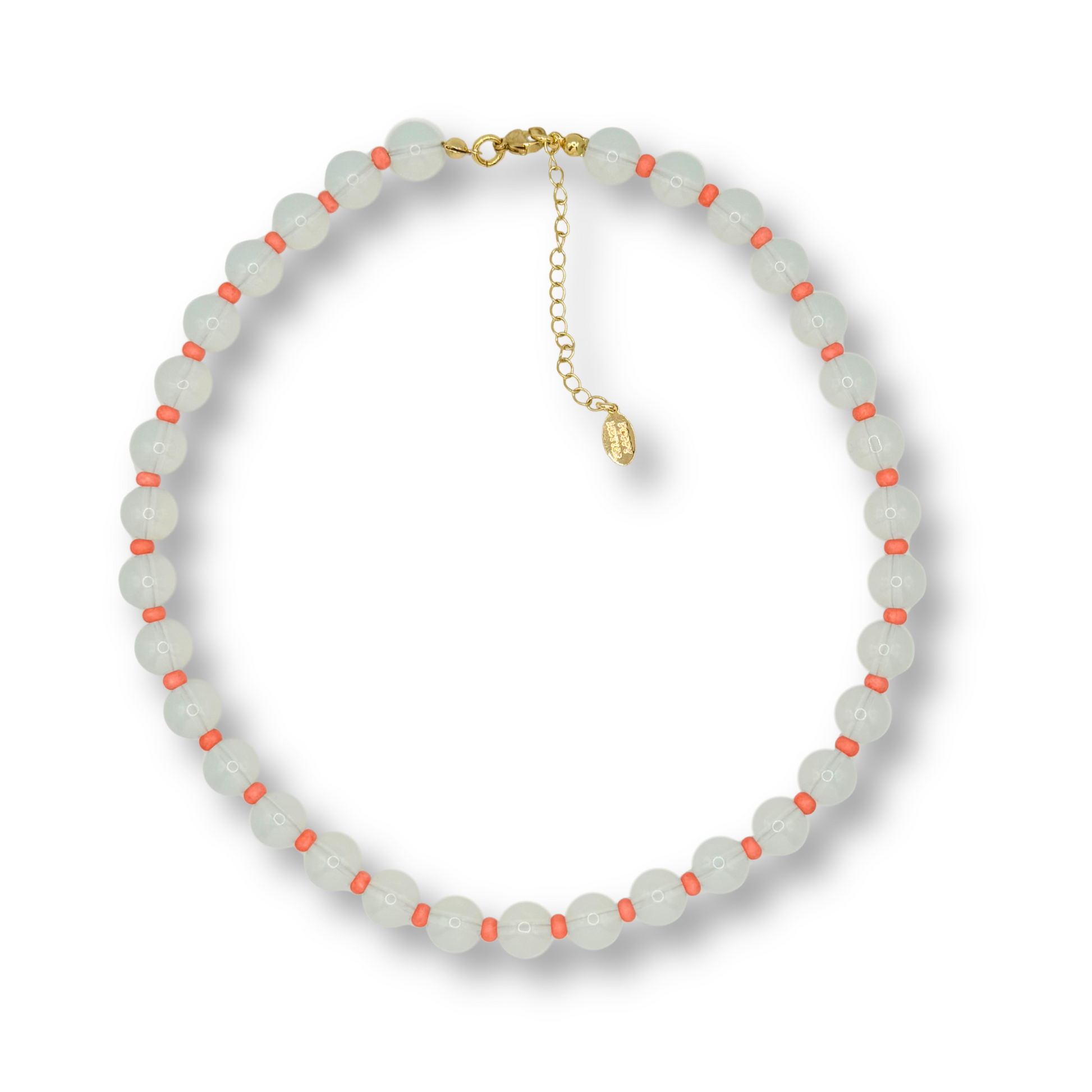 A beaded necklace featuring translucent pale greenish-white round beads with small coral-orange accents, accented by a gold-tone clasp and extender chain.