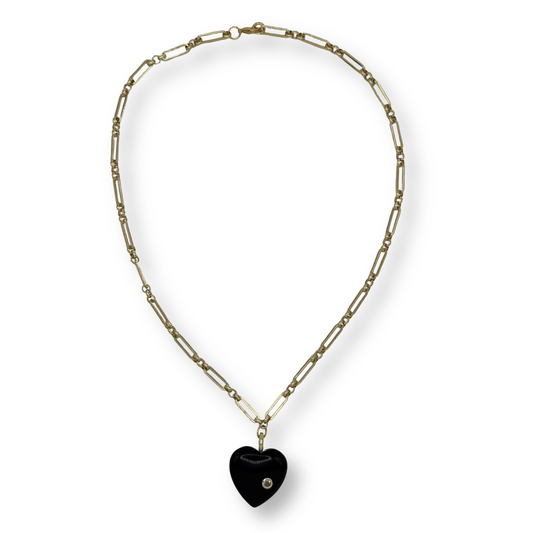 Necklace with a black heart pendant on a white background