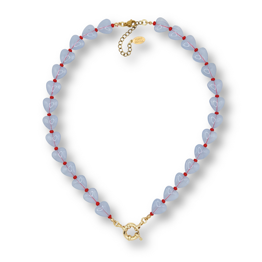 Necklace with blue beads and gold clasp on a white background