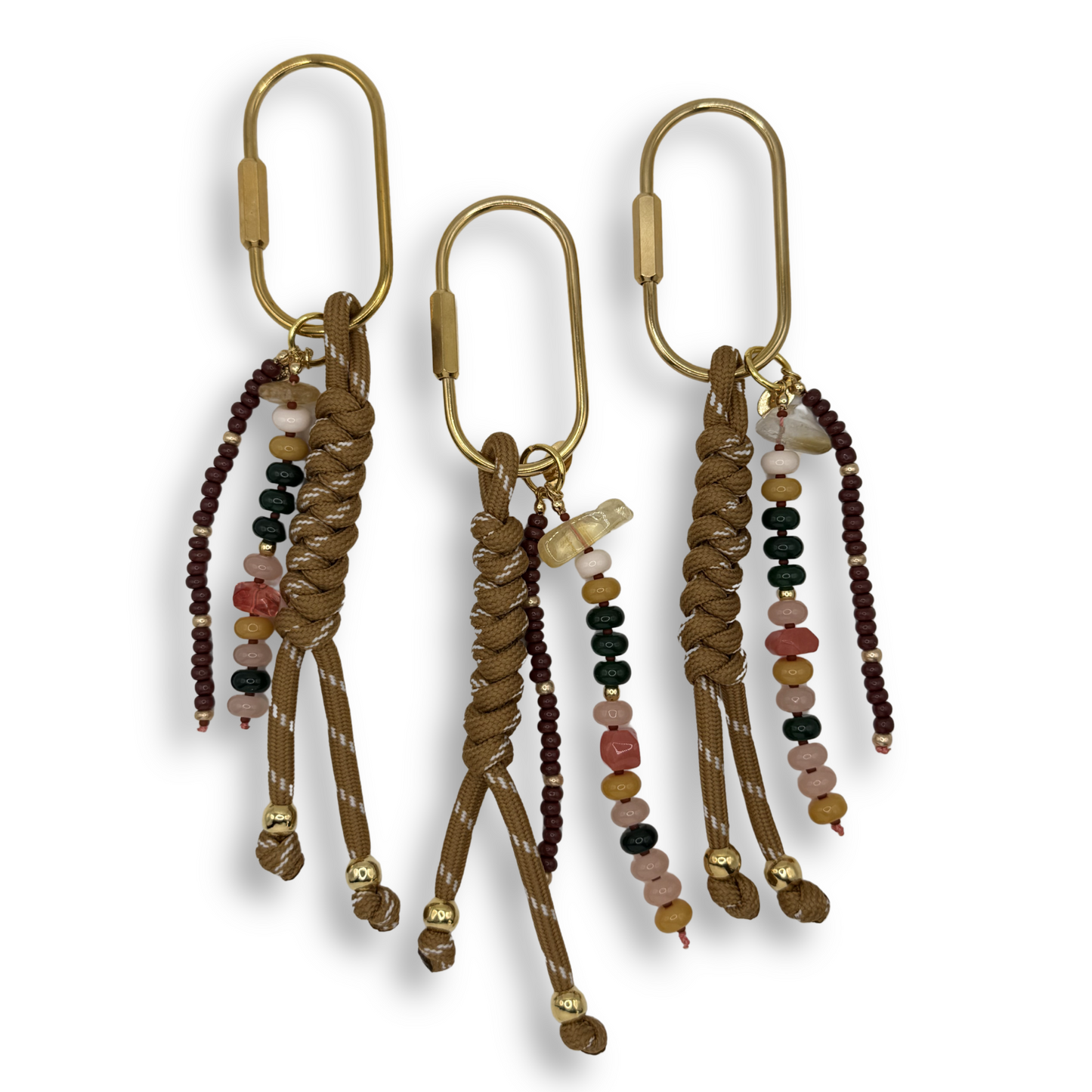 beaded bag charm with gold clasps on a white background